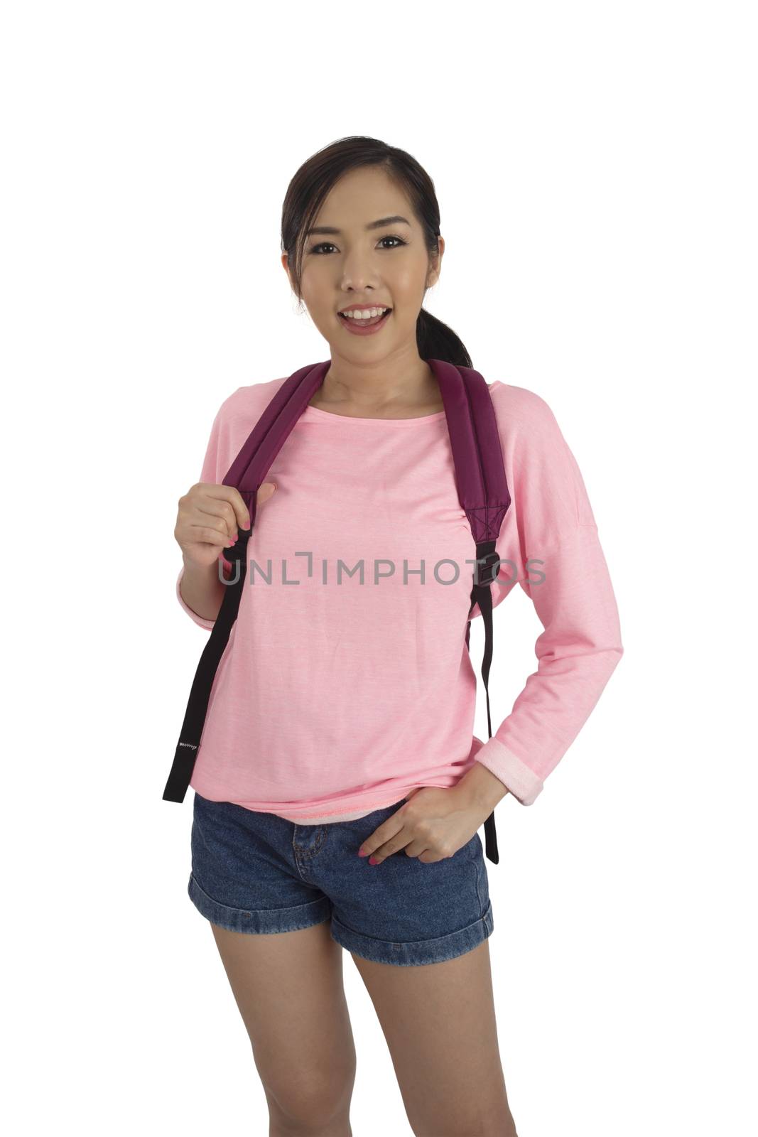 Asian girl in pink t-shirt and blue jean shorts with backpack. by pandpstock_002