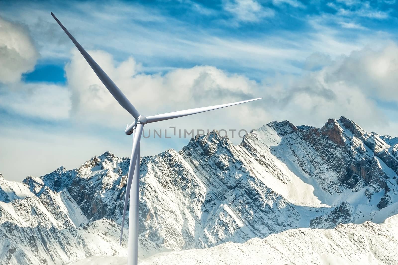 Wind turbine power on the sunrise in mountain background by Surasak