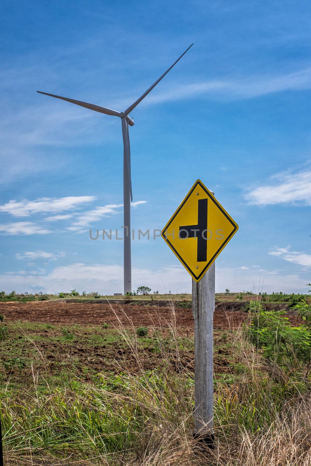 Traffic Sign and Wind turbine power at daylight 