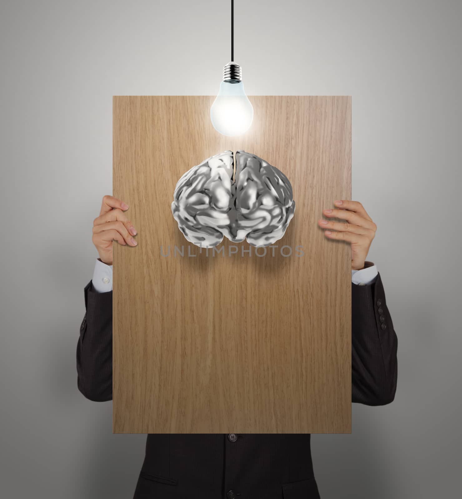 businessman hand show wooden poster of 3d metal brain as concept 
