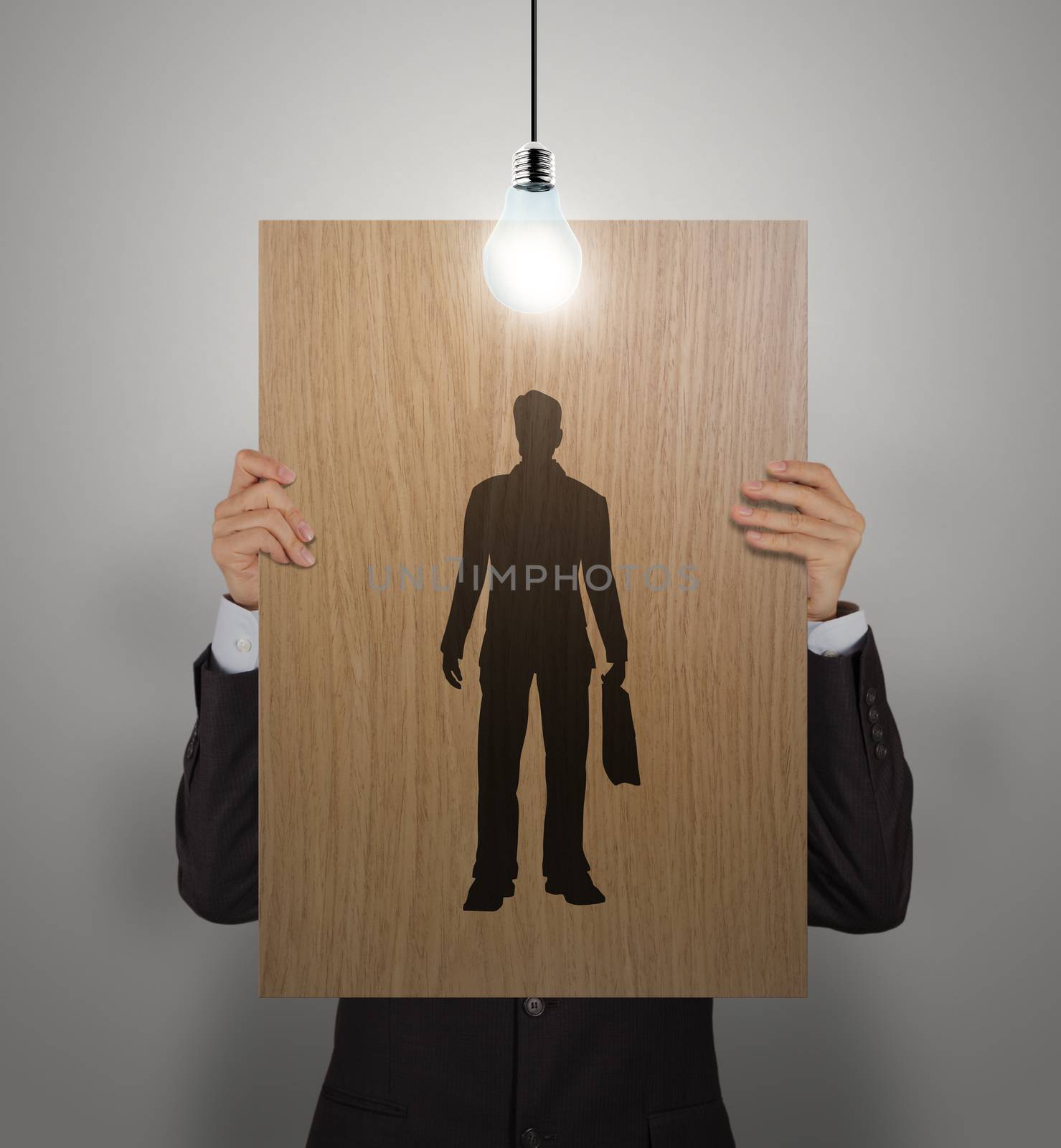 businessman hand with wooden poster choosing people icon as human resources concept 