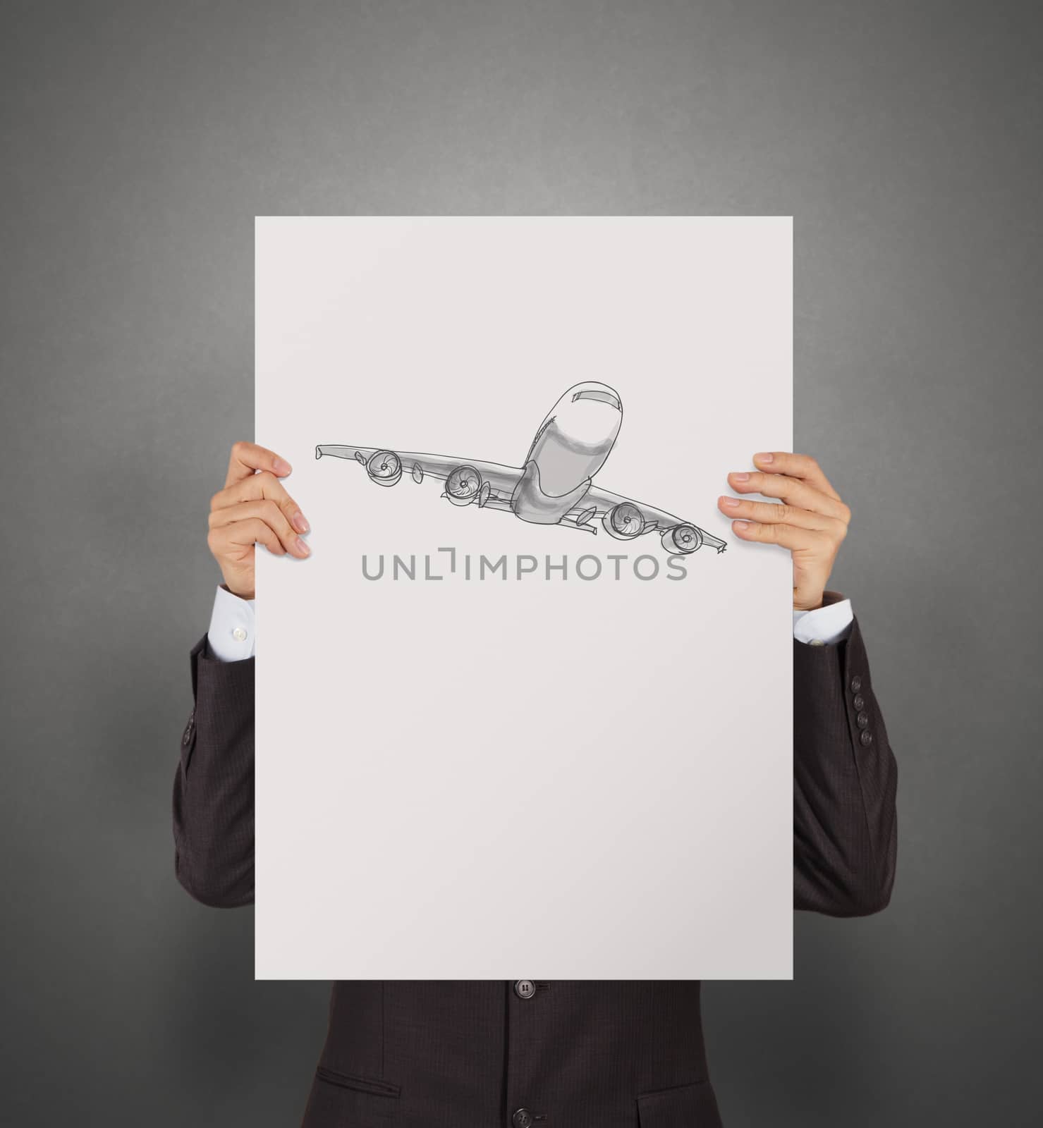 businessman showing poster of hand drawn airplane with crumpled paper background as concept 