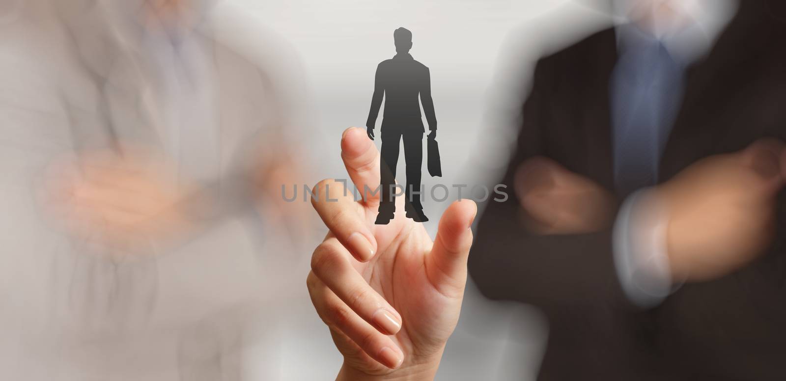 businessman hand choosing people icon as human resources concept by everythingpossible