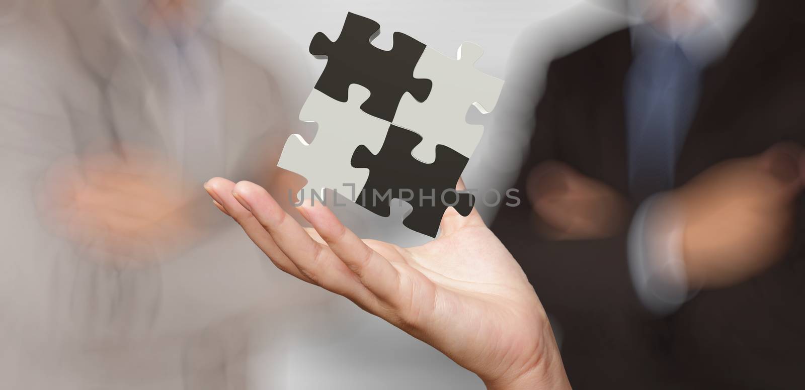 businessman hand showing 3d puzzle partnership sign as concept