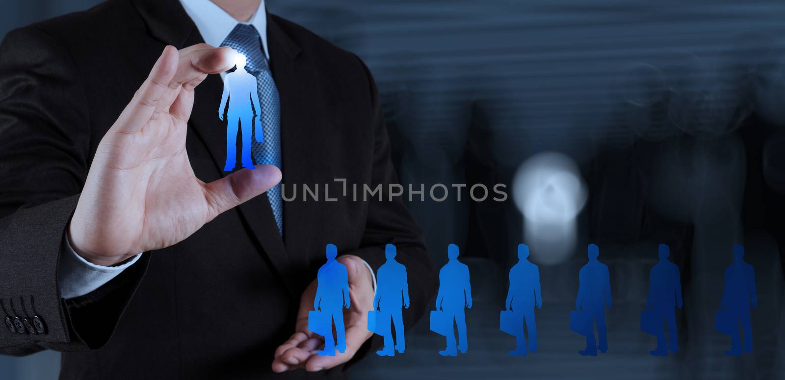 businessman hand choosing people icon as human resources concept 