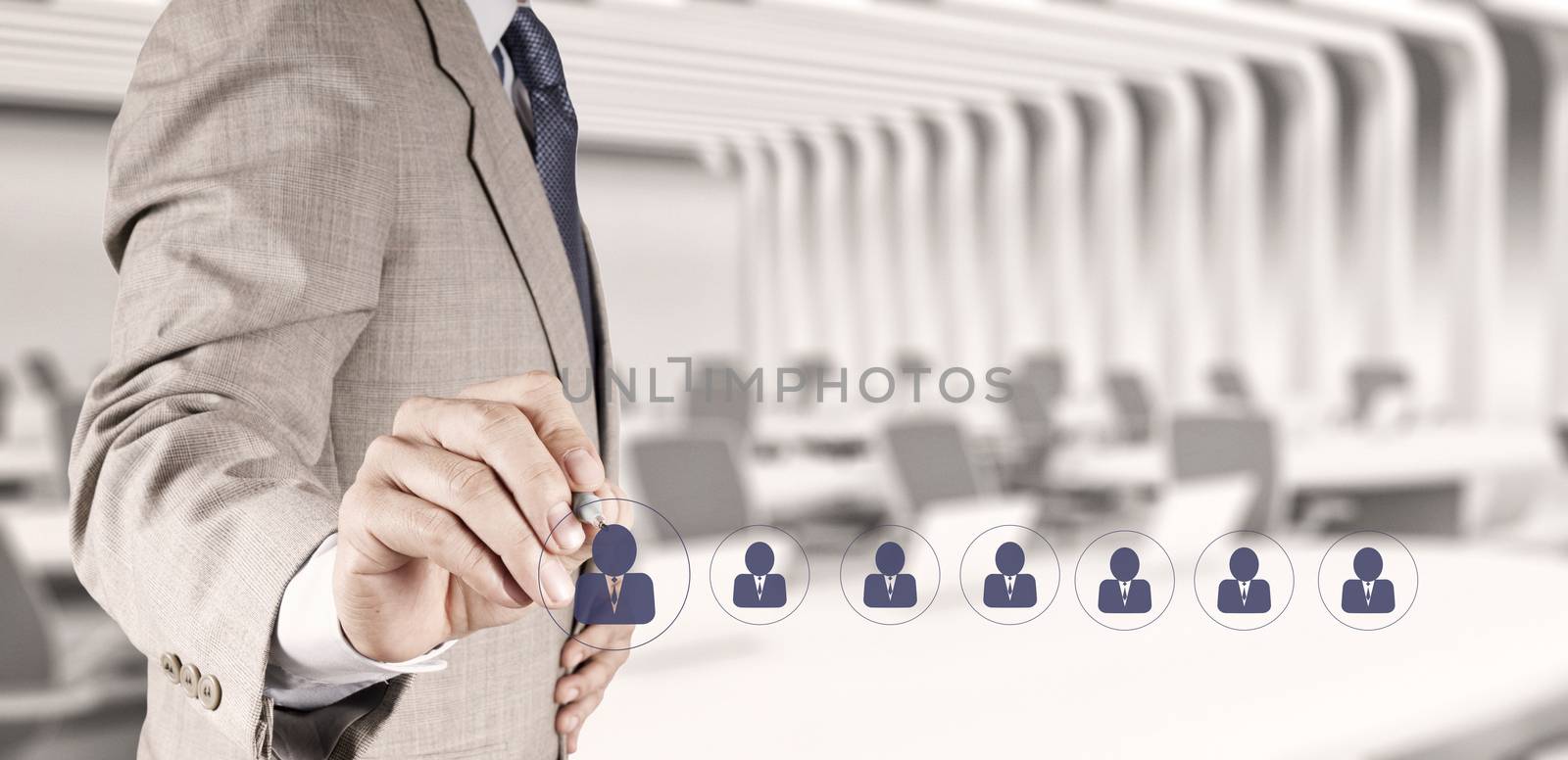 businessman hand choosing people icon as human resources concept