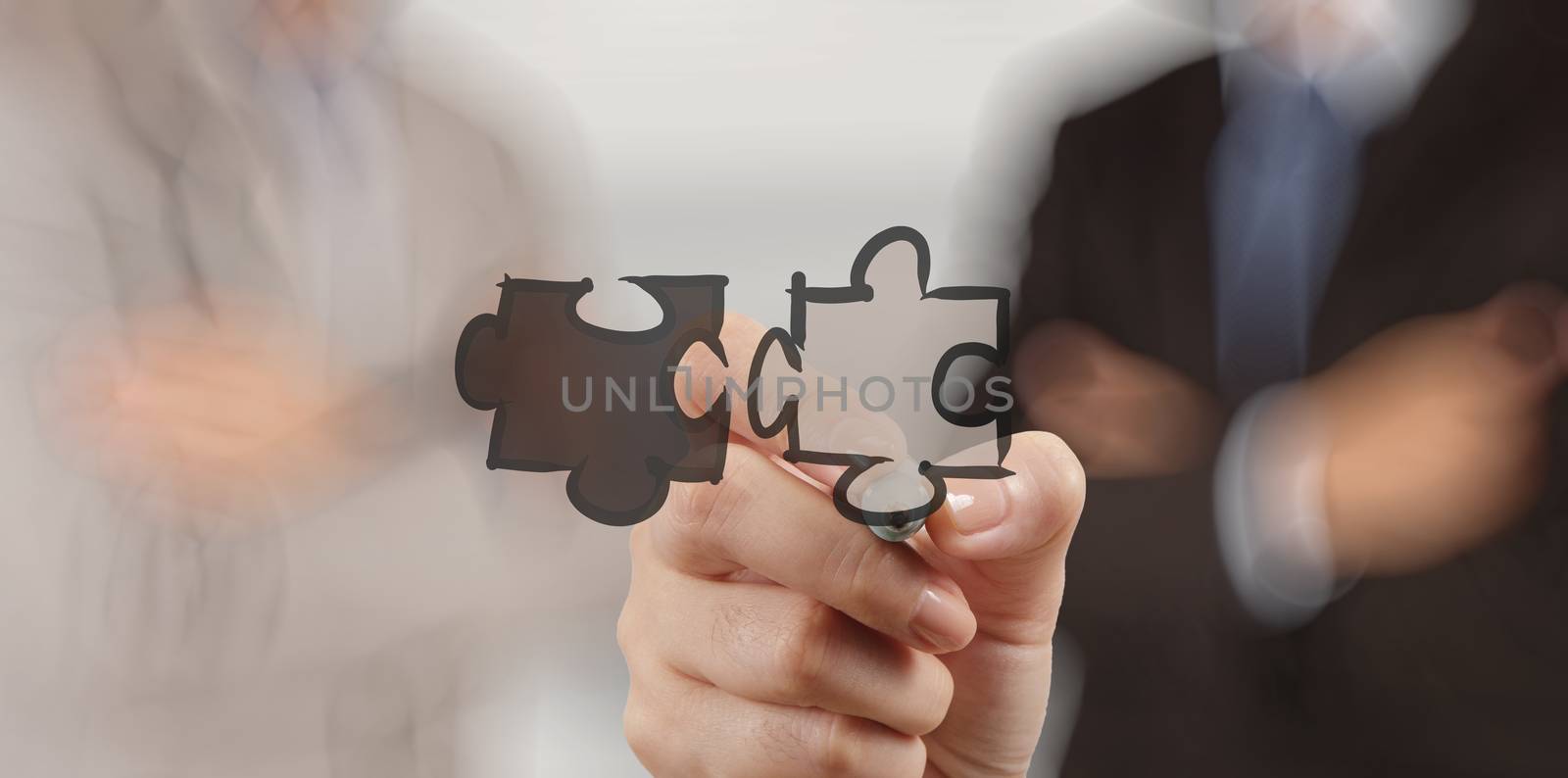 businessman hand showing  puzzle partnership sign as concept by everythingpossible