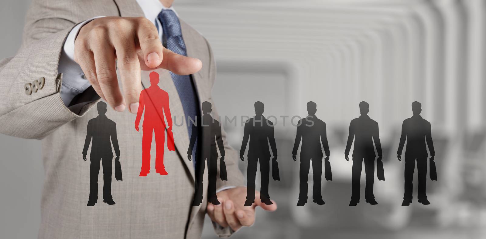 businessman hand choosing people icon as human resources concept