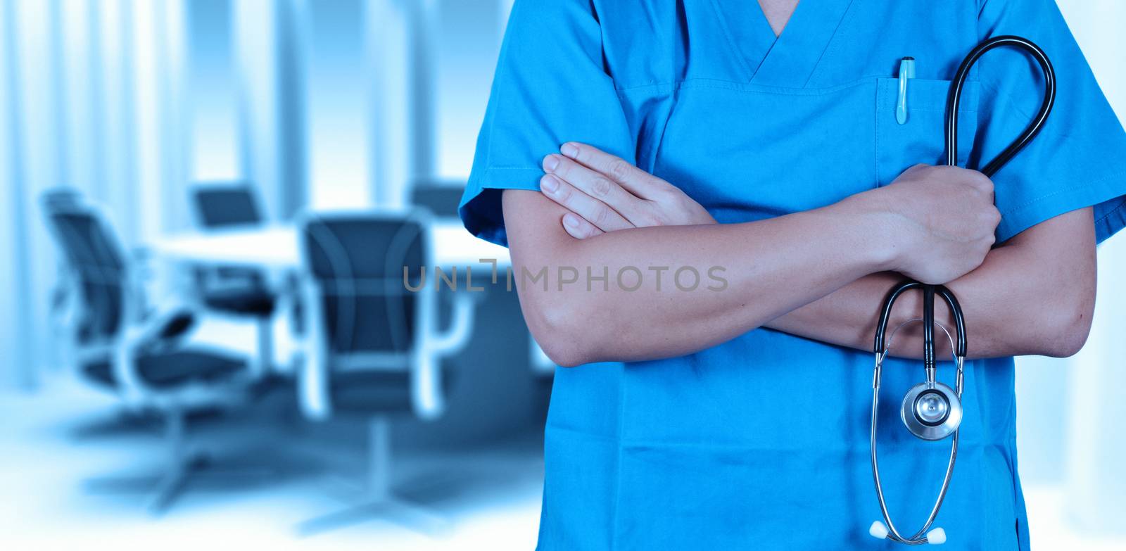 Doctor with a stethoscope in the hands and office background by everythingpossible