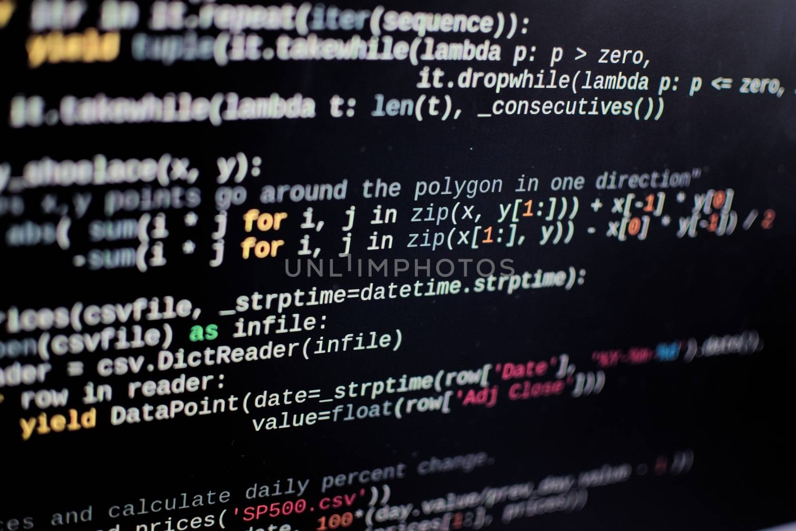 Source code lines on a computer screen. Screen pixels can be seen. by hernan_hyper