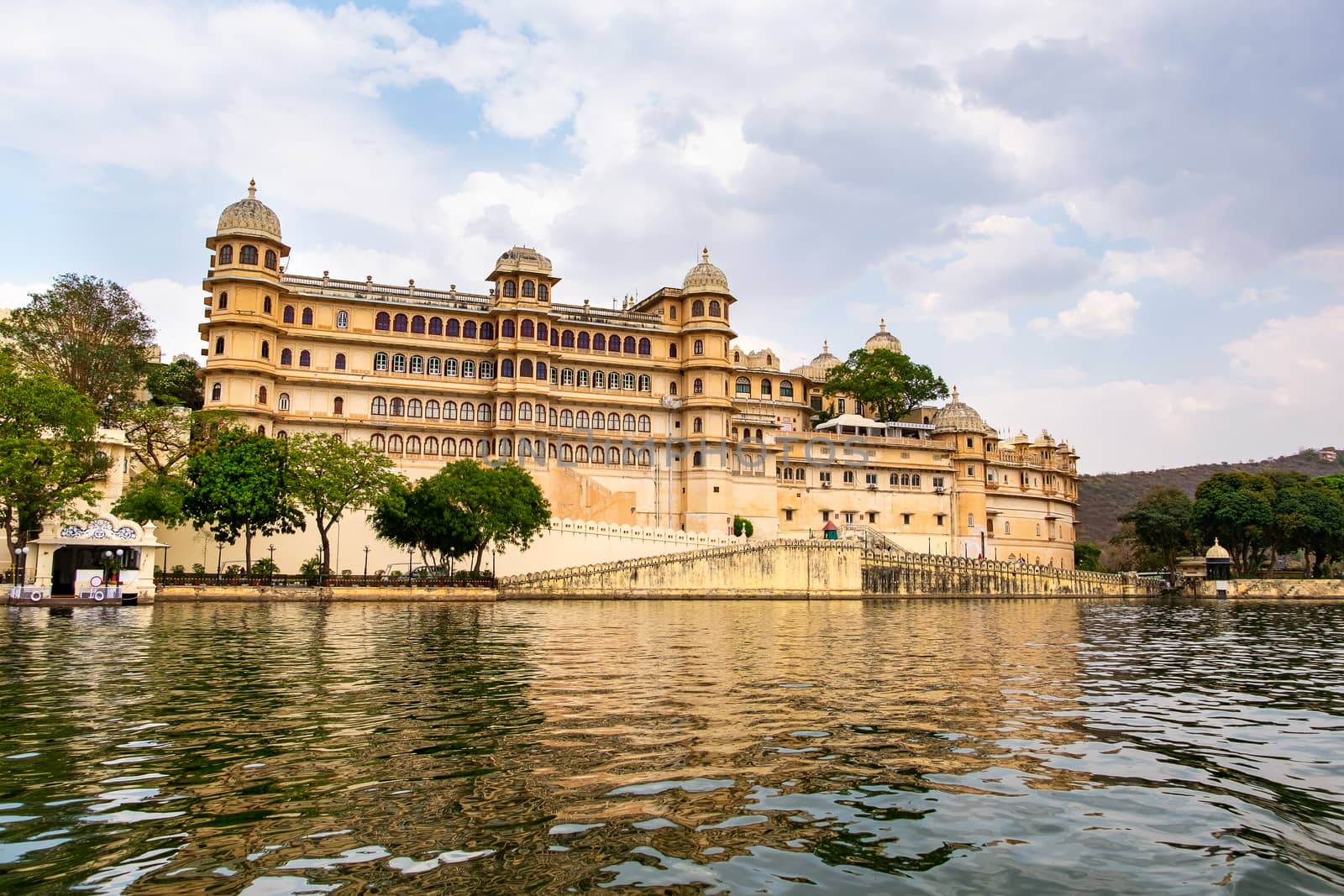 Udaipur city at lake Pichola in the morning, Rajasthan, India. View of City palace reflected on the lake.