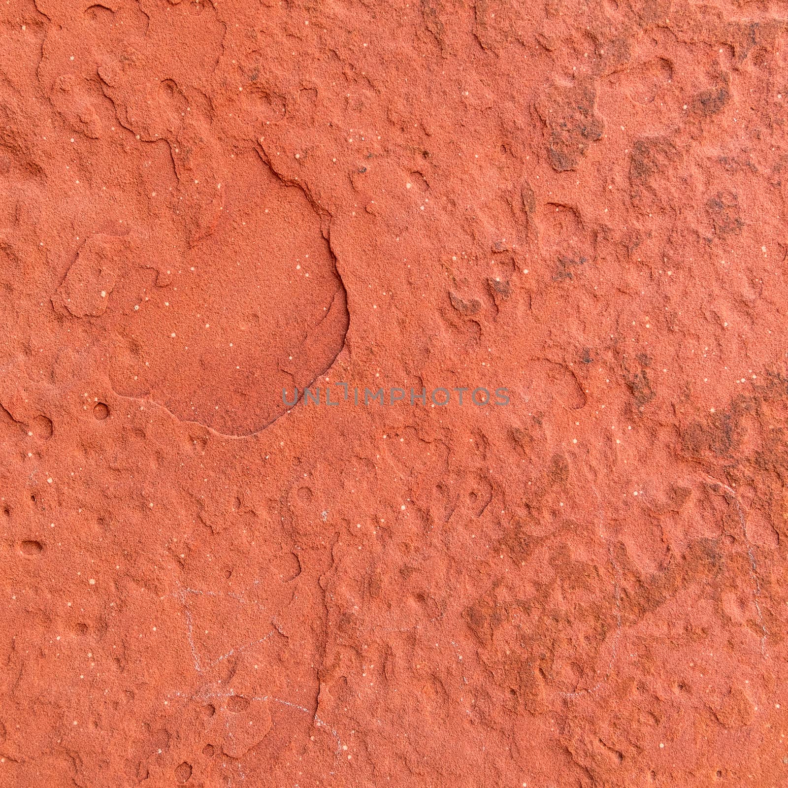 Red rough stone texture background. Material construction and architectural detail.