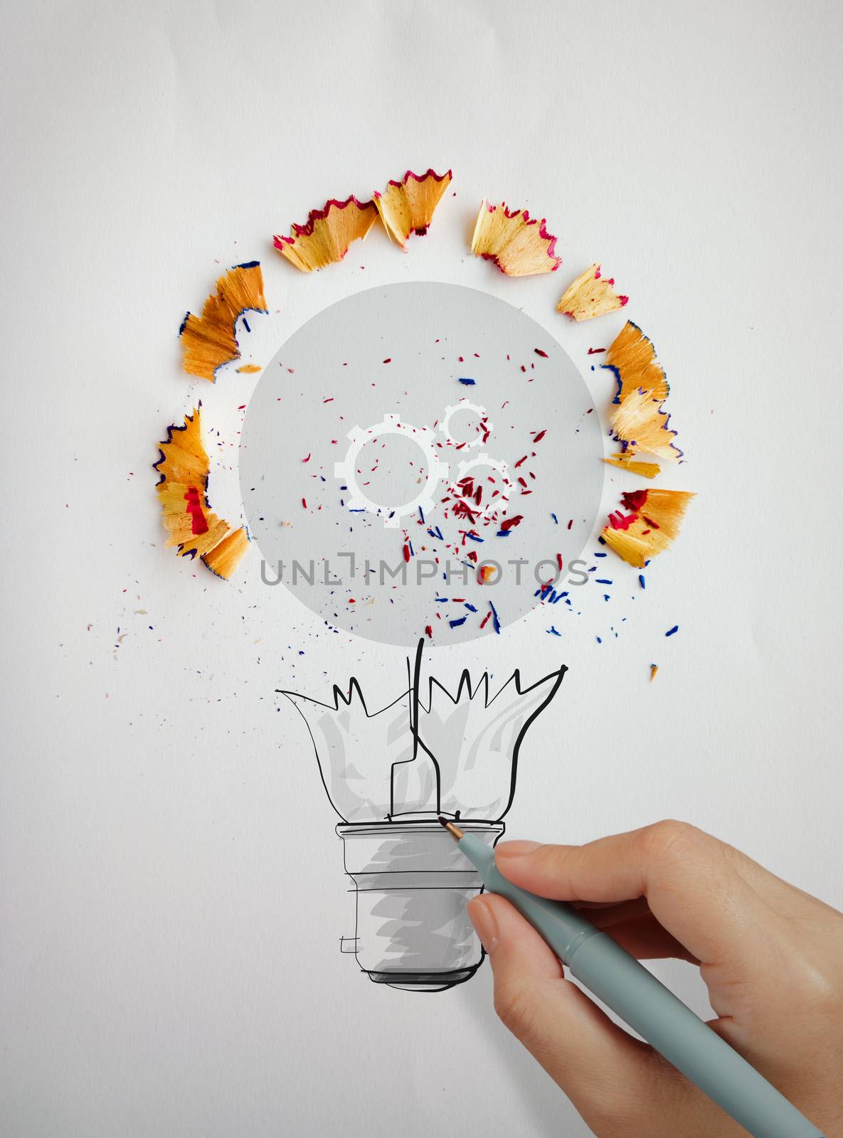 hand drawing light bulb with pencil saw dust and gears icon on paper background as creative concept 