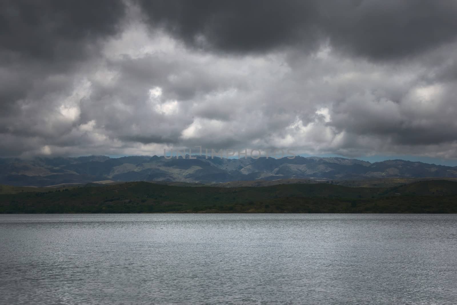 Dark storm clouds over lake La Florida, in San Luis, Argentina by hernan_hyper