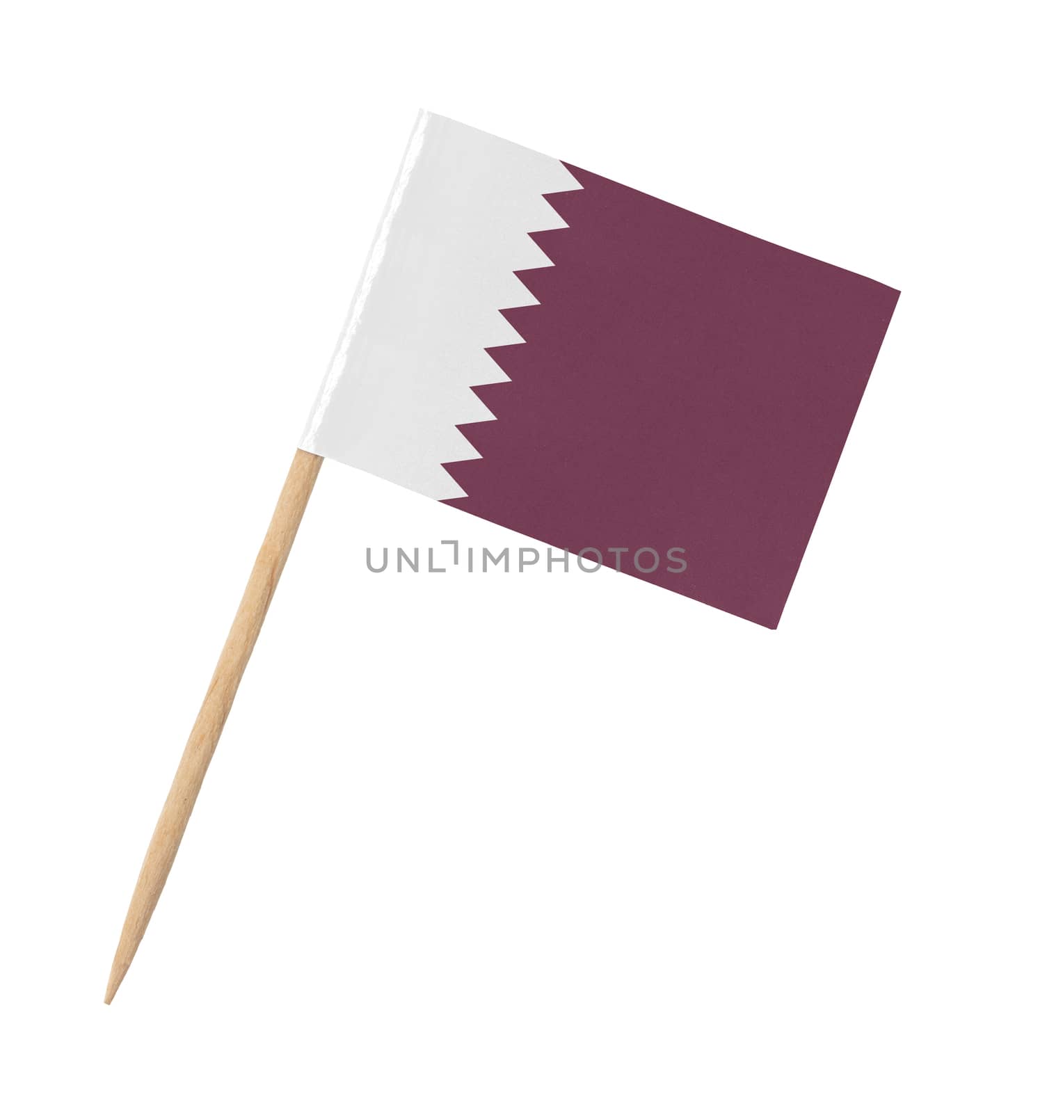 Small paper flag of Qatar on wooden stick, isolated on white