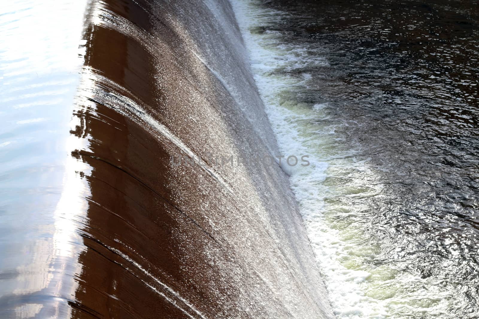 Dam water flow, Surface flow, Flowing water at Small water reservoir, Rural water retention dam, splash, Sponge spray