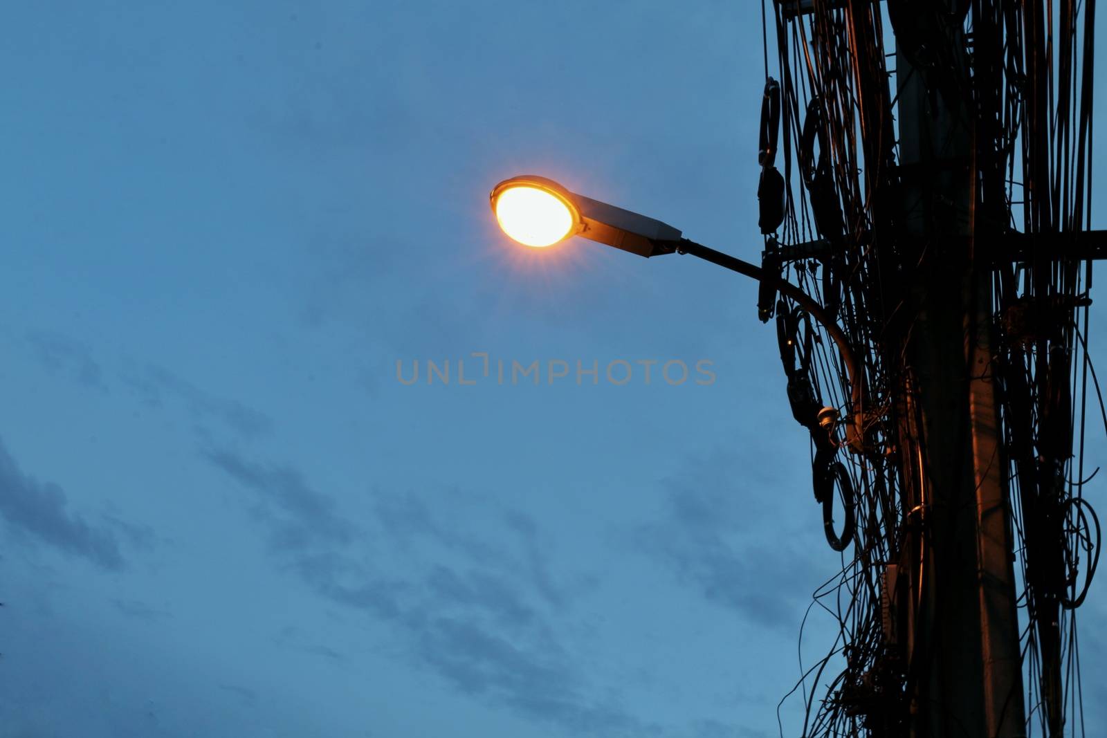 Street lights mounted on poles at evening time