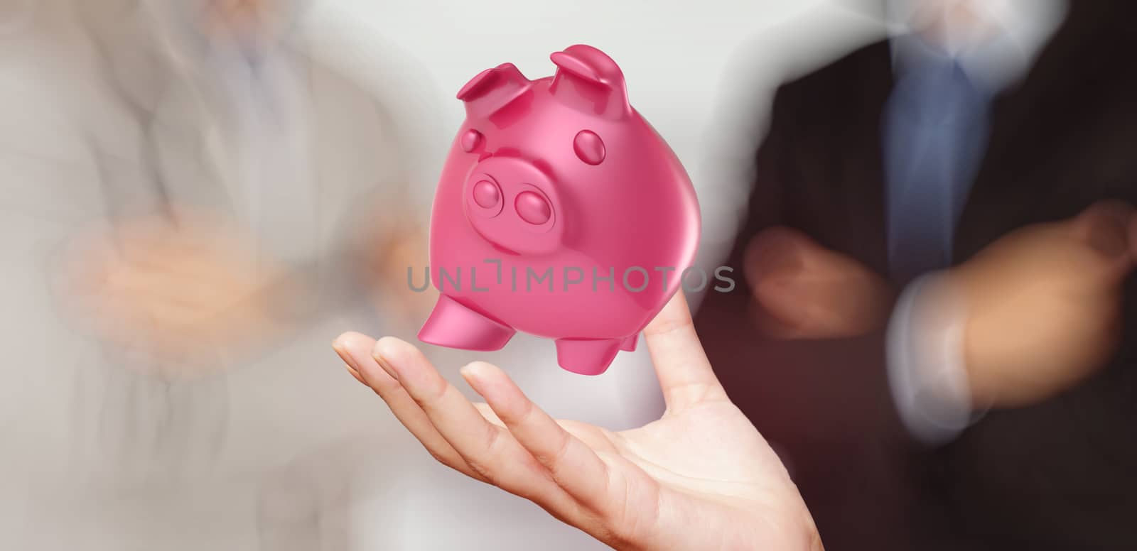 businessman hand shows piggy bank as concept 