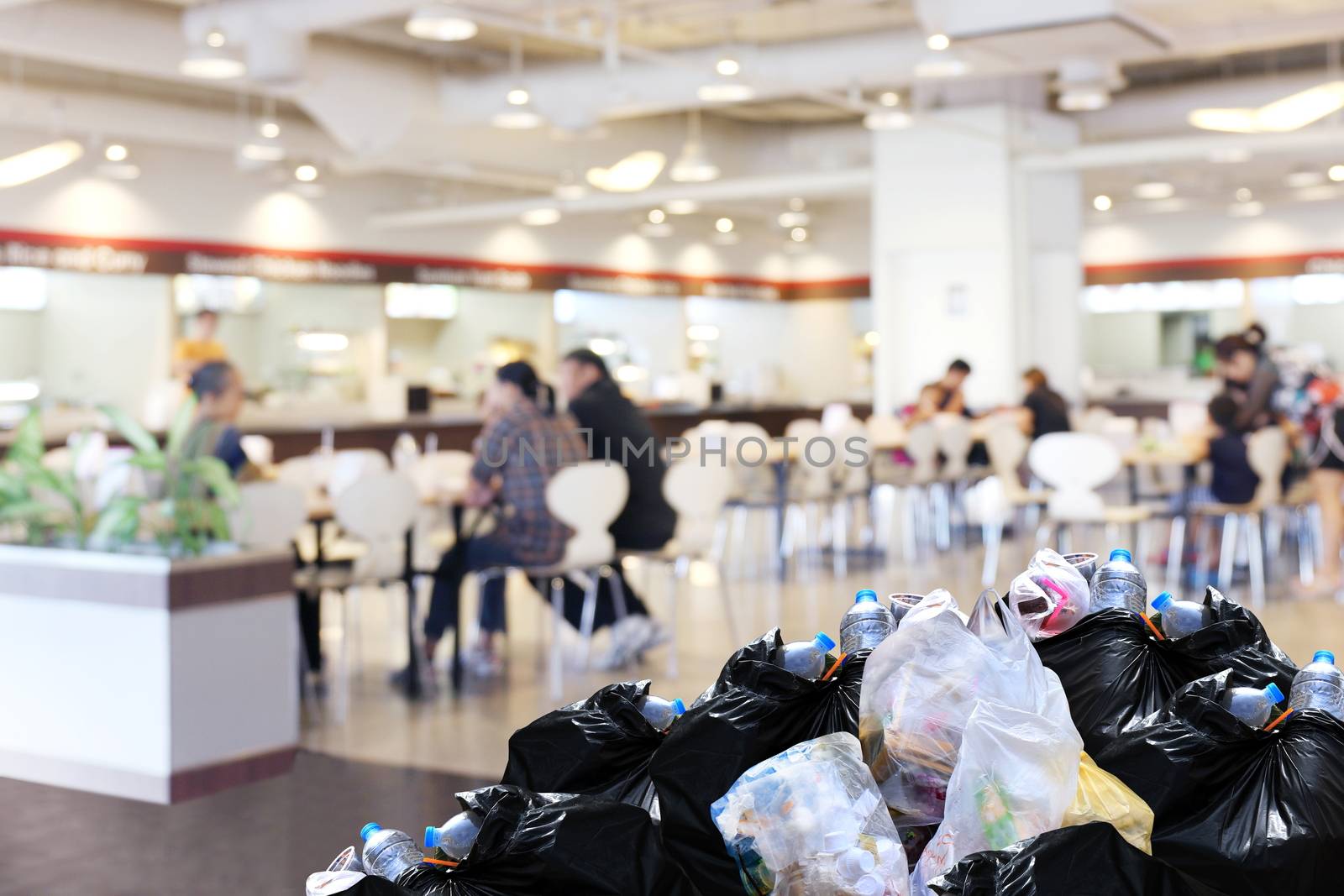 plastic waste garbage bag black bin full Lots pile of junk at front canteen food court mall department store background, pollution garbage bin pile dump trash waste by cgdeaw