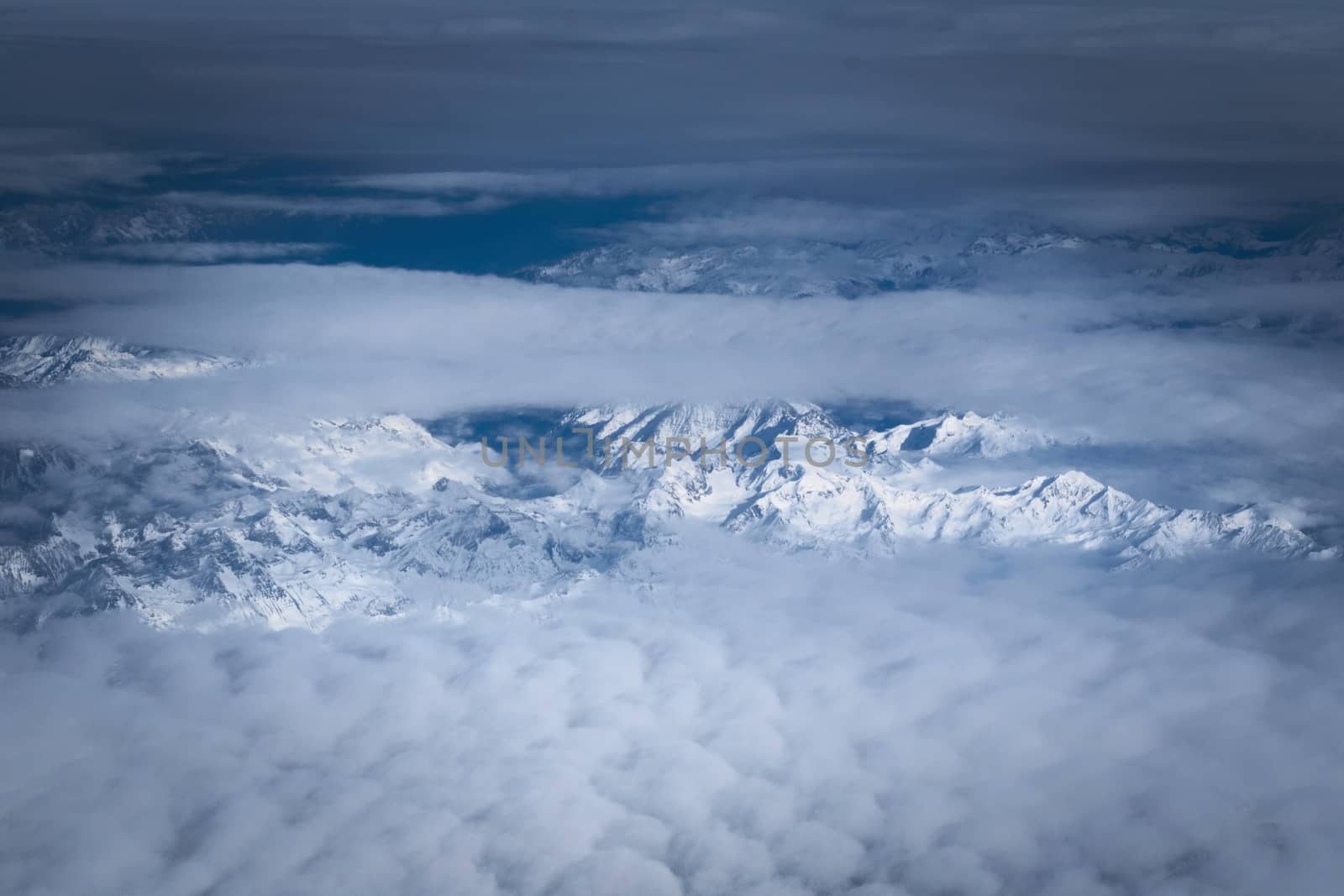 Snowy mountains in the Italian alps. Aerial, high altitude view. by hernan_hyper