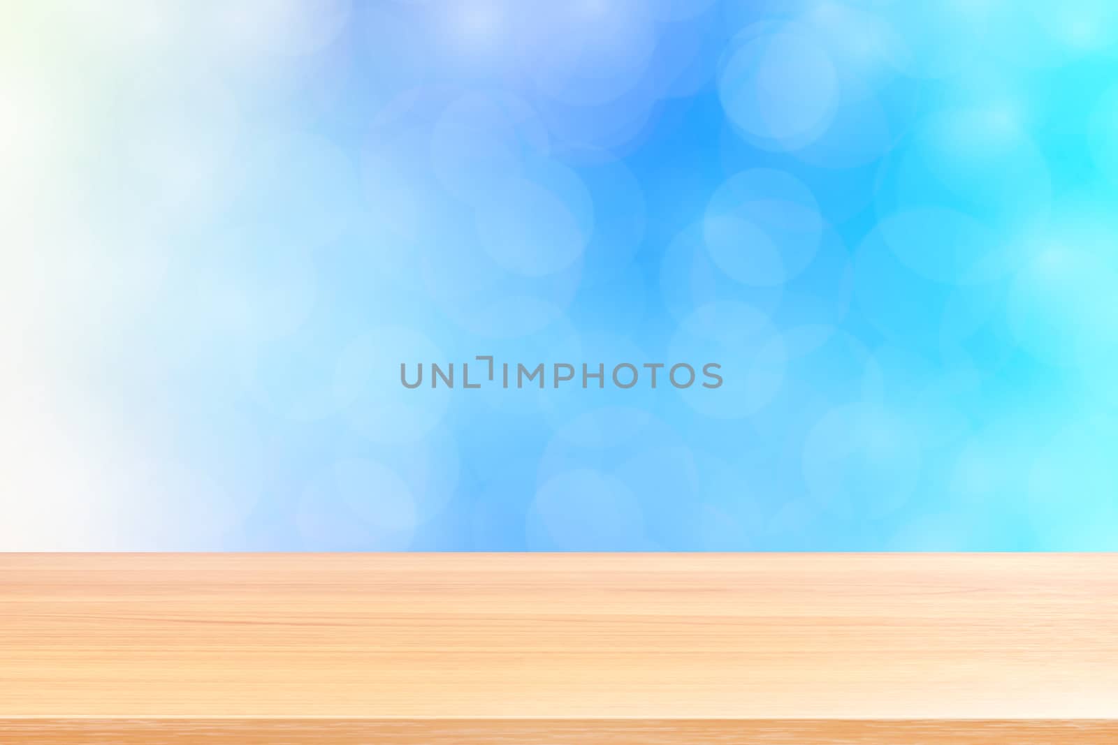 empty wood table floor on blurred bokeh soft blue gradient background, wooden plank empty on blue bokeh colorful light shade, colorful bokeh lights gradient blue soft for banner advertising products