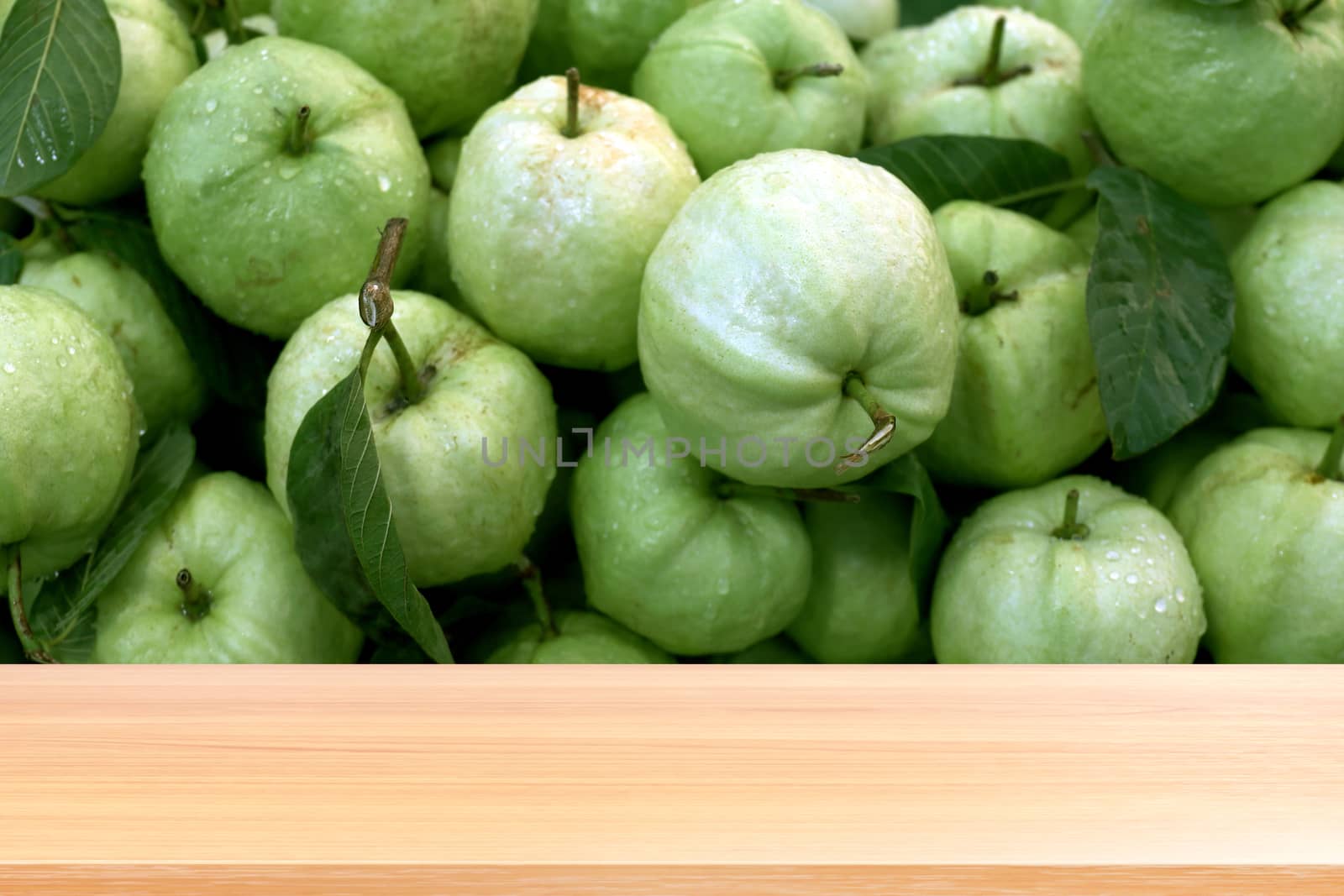 wood plank on guava fruit fresh background, empty wood table floors on guava organic green fresh view, wood table board empty front guava organic for mock up display products guava juice clean food