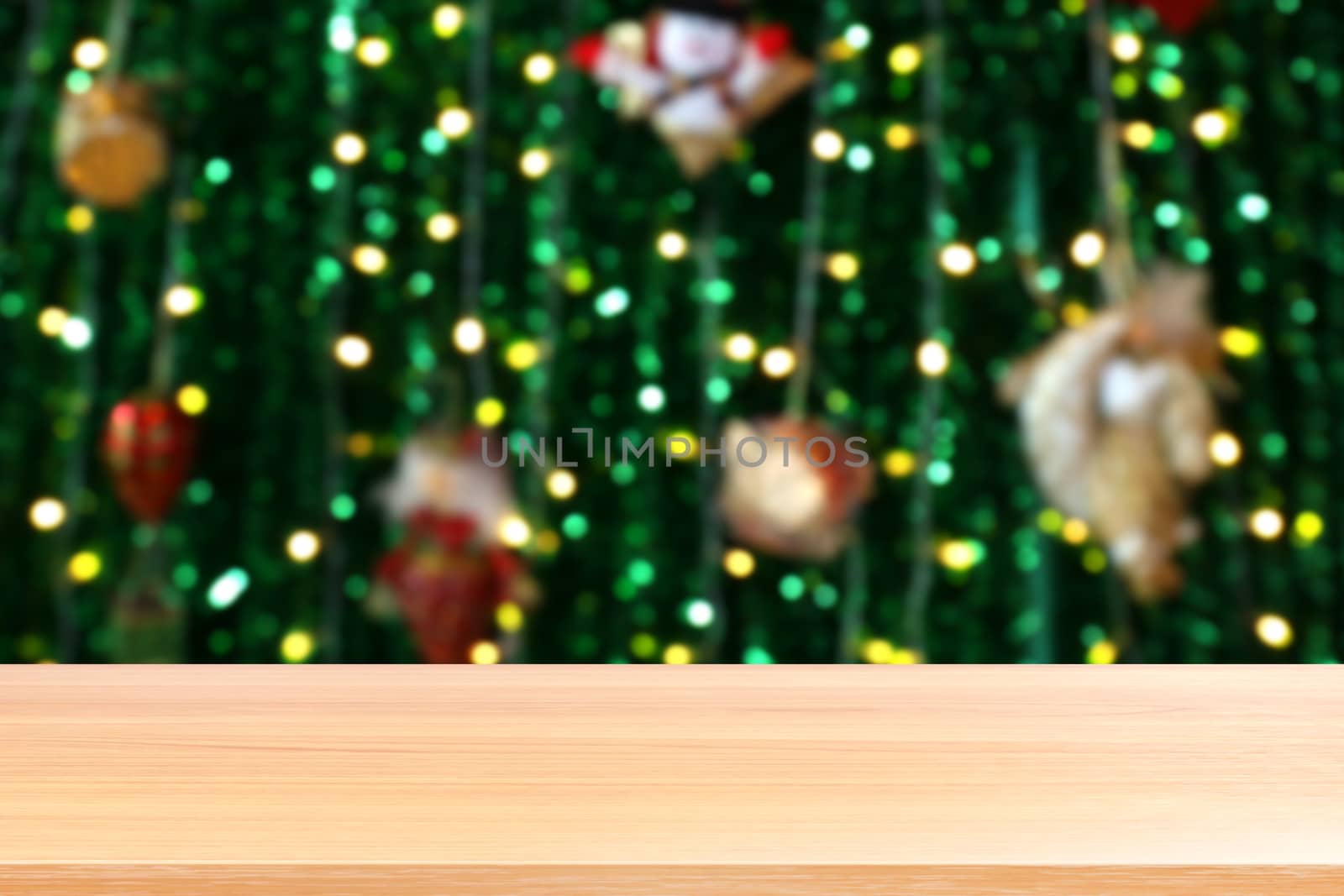 wood plank on lighting blurred christmas tree decoration background, empty wood table floors on lighting green christmas bokeh, wood table board empty front green glitter background light colorful