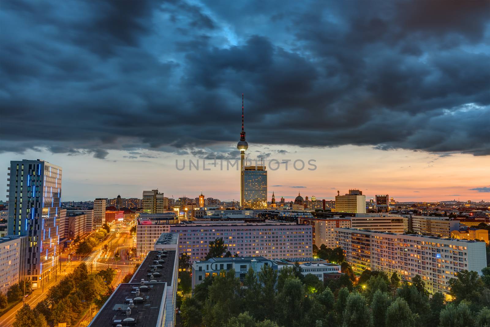 Dark sky over downtown Berlin at sunset with the Television Tower in the back
