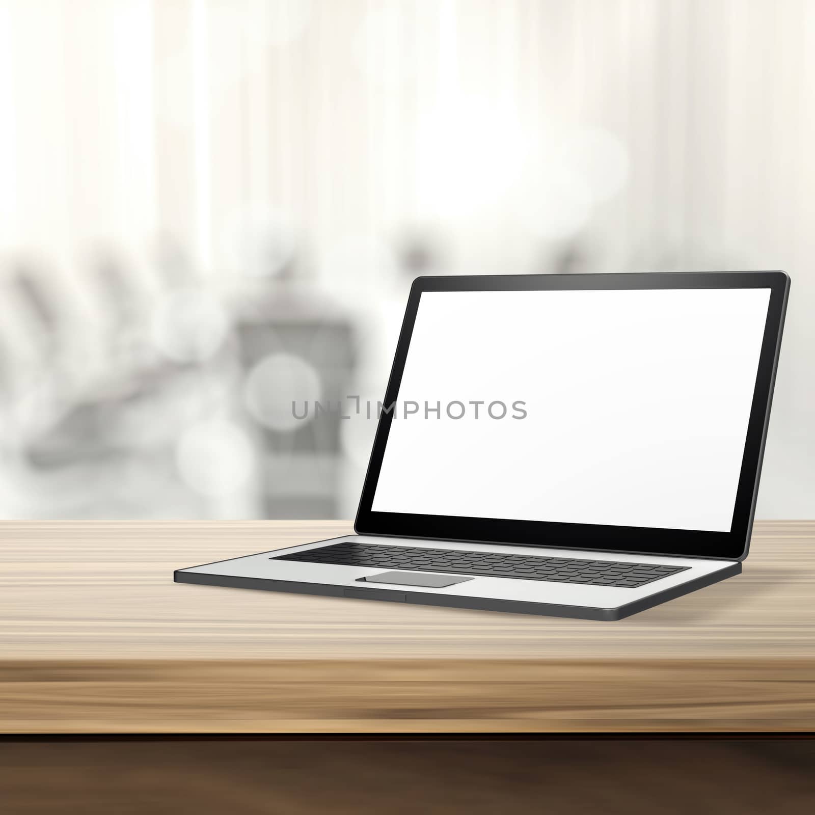 Laptop with blank screen on wood table and blurred background