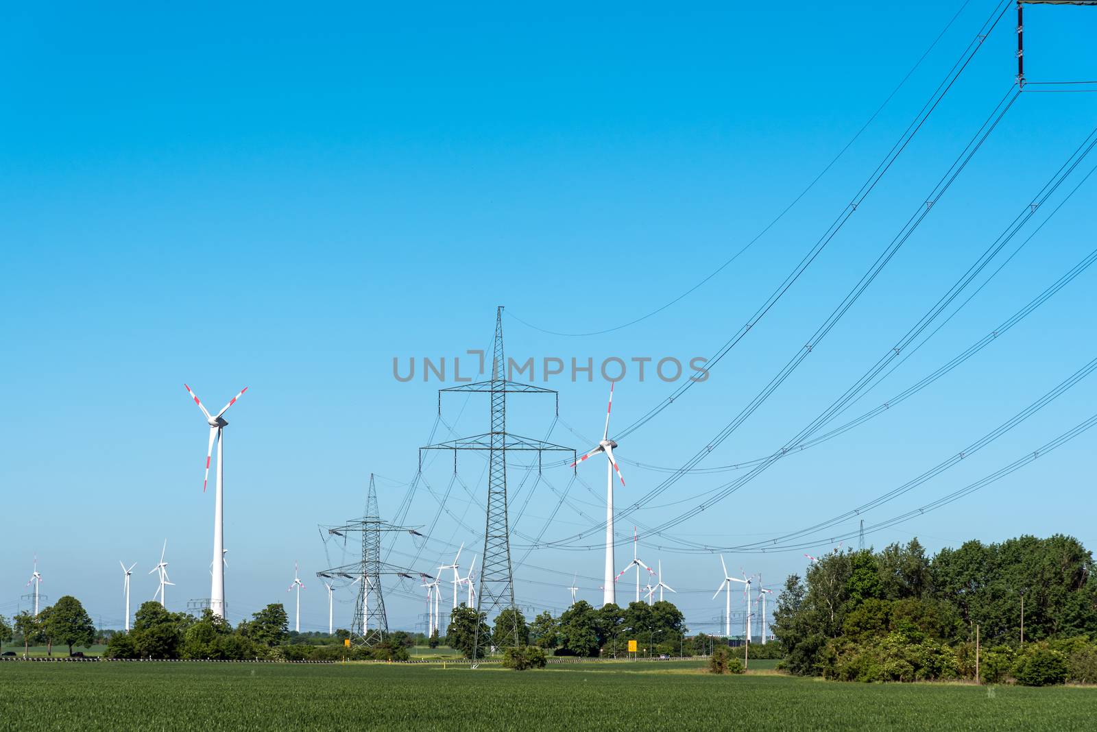Windwheels and power transmission lines seen in rural Germany