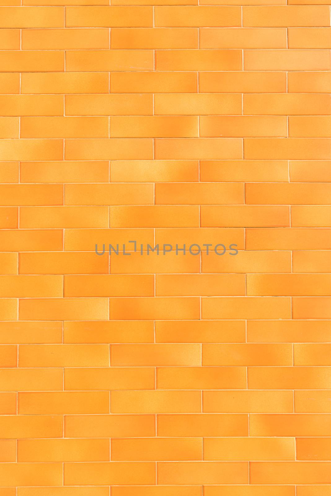 An orange tiled background with relatively small tiles