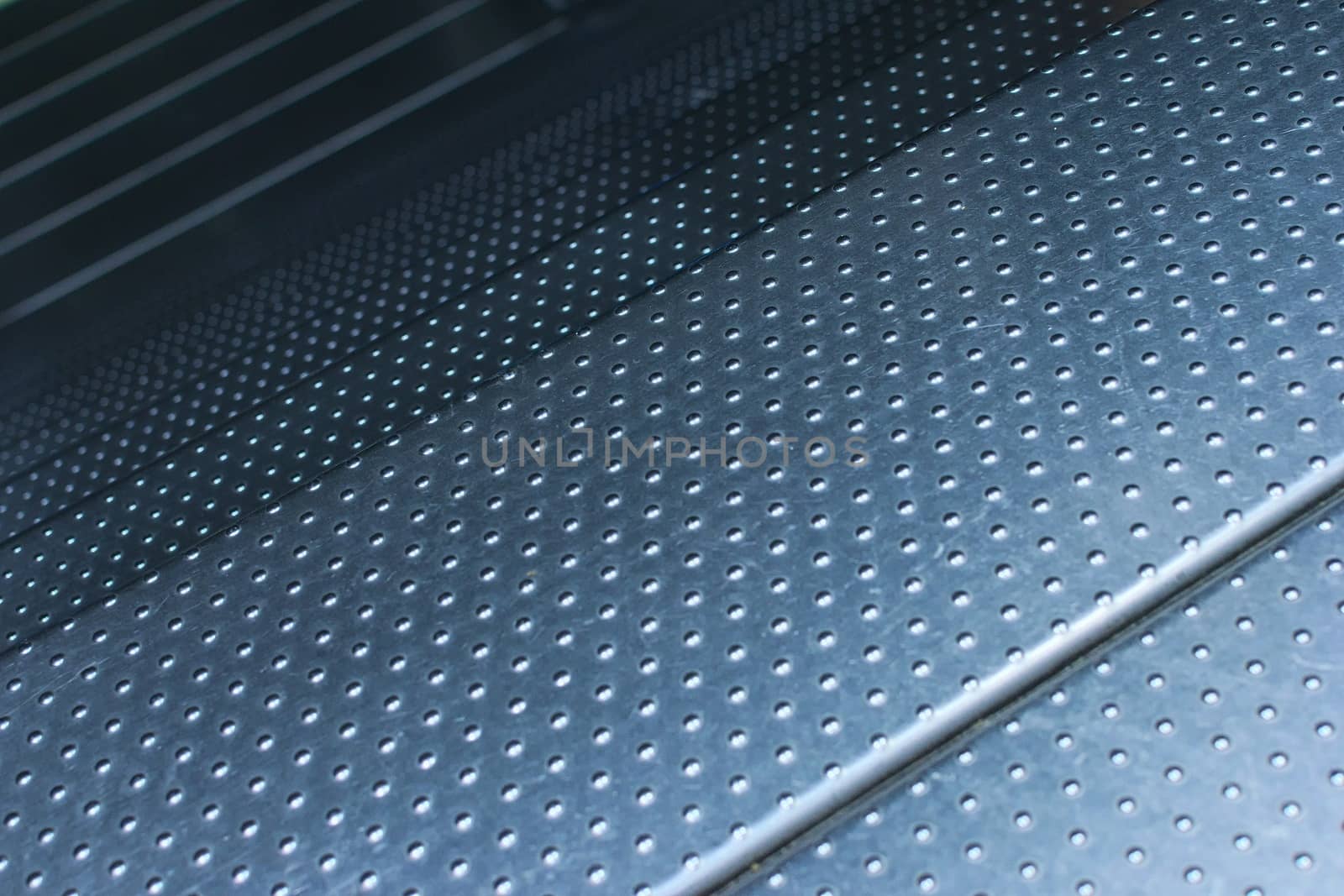 Studded steel plate flooring. Industrial background texture, high resistance material.