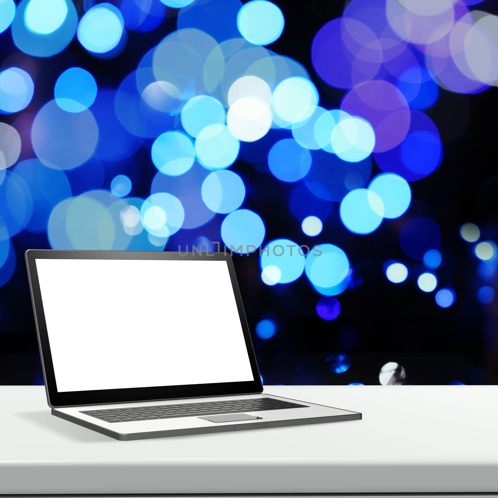 Laptop with blank screen on laminate table and blurred backgroun by everythingpossible