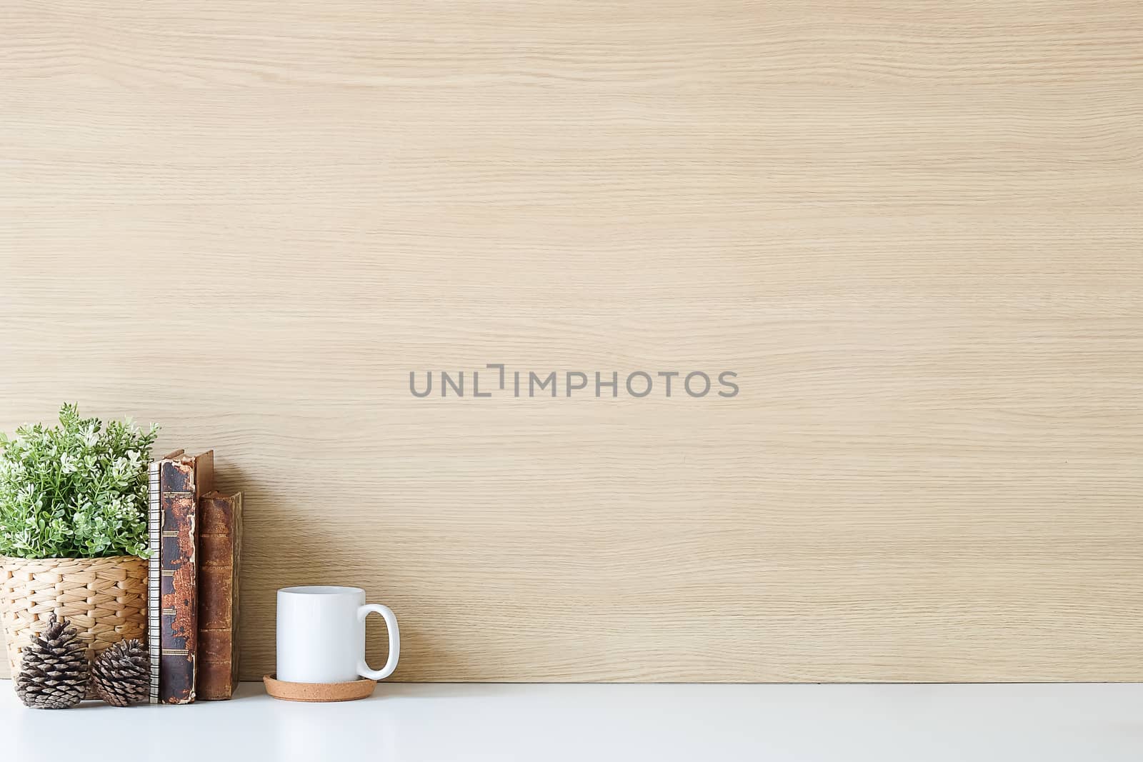 Mockup workspace desk and copy space books,plant and coffee on white desk.