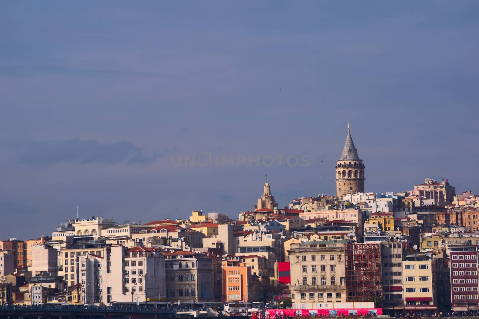 Galata Tower over the skyline of Istanbul, Turkey, on a sunny afternoon. by hernan_hyper