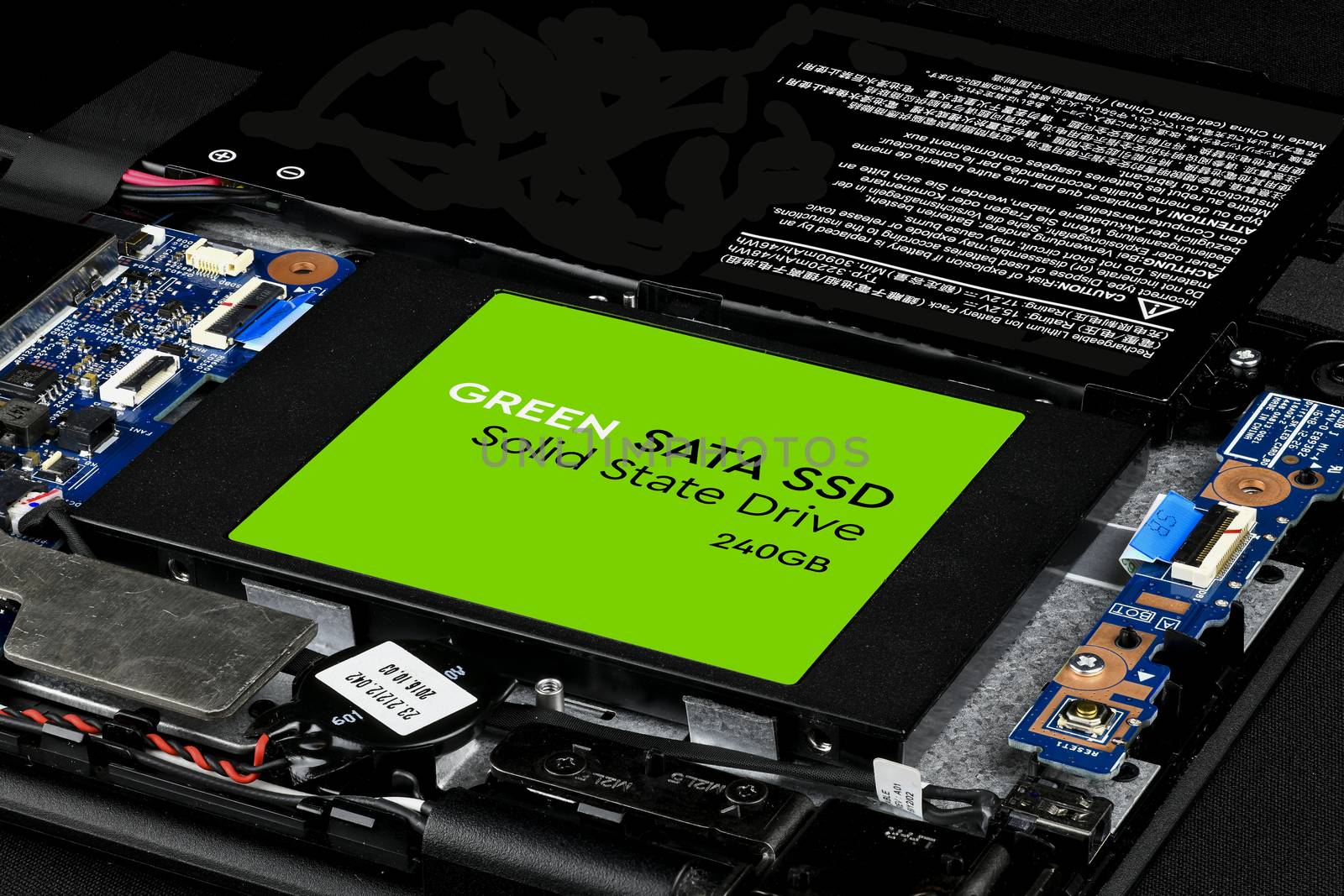 Green SATA SSD hard drive of a laptop