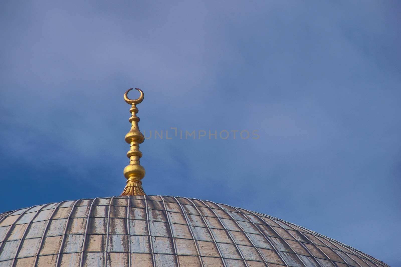 Golden ornament on top of the dome of Hagia Sophia, in Istanbul, Turkey. Architectural detail. by hernan_hyper