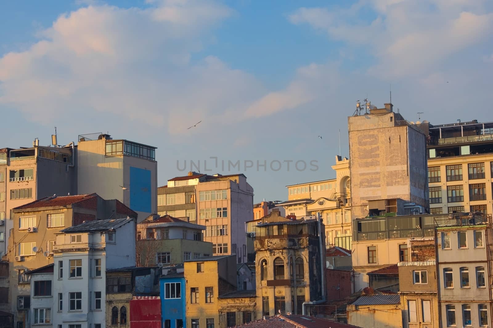 Building facades at sunset in Istambul, Turkey. by hernan_hyper