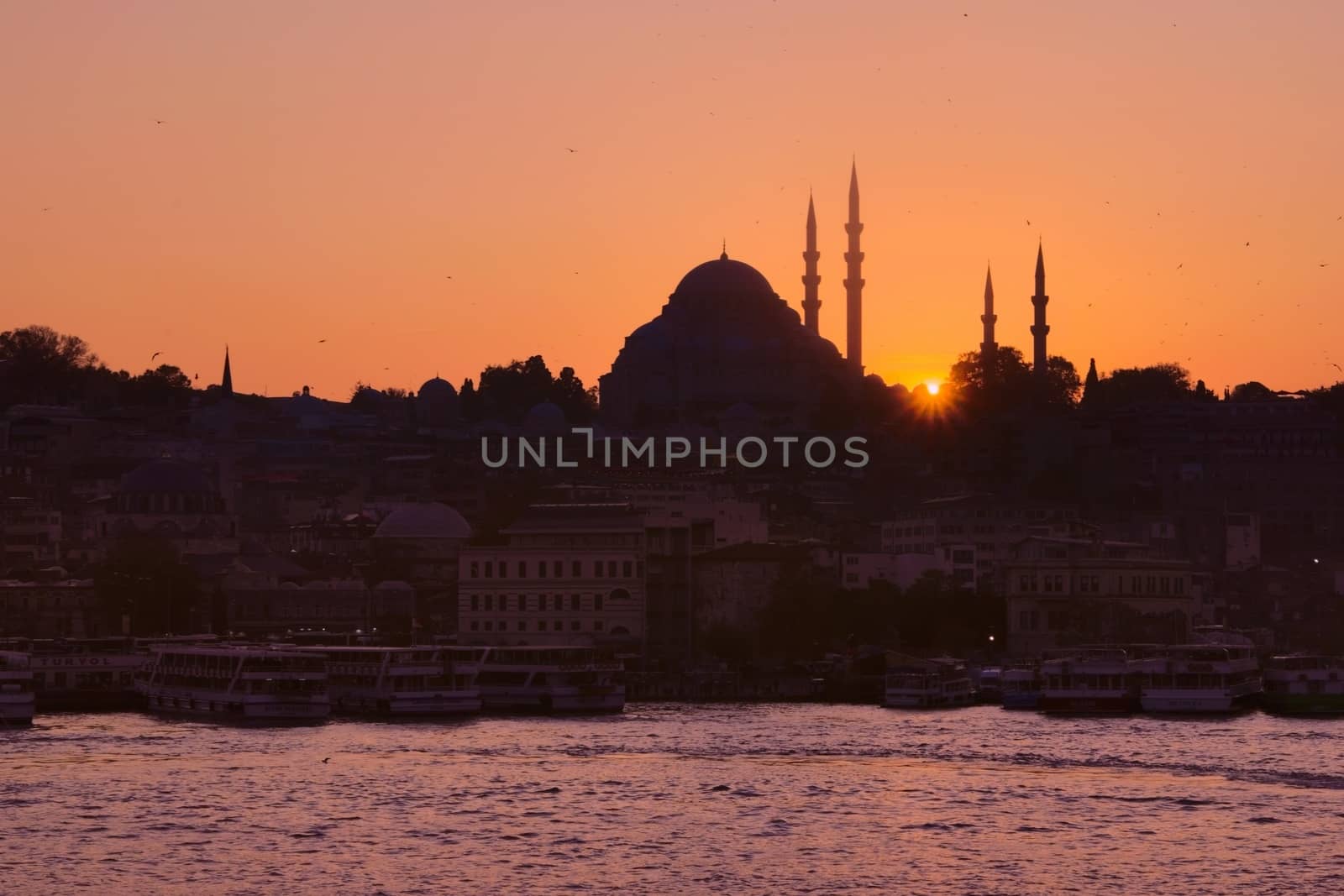 Hagia Sophia, the most important tourist attraction of Istanbul, Turkey, silhouetted against the twilight sky from across the Bosphorus. by hernan_hyper