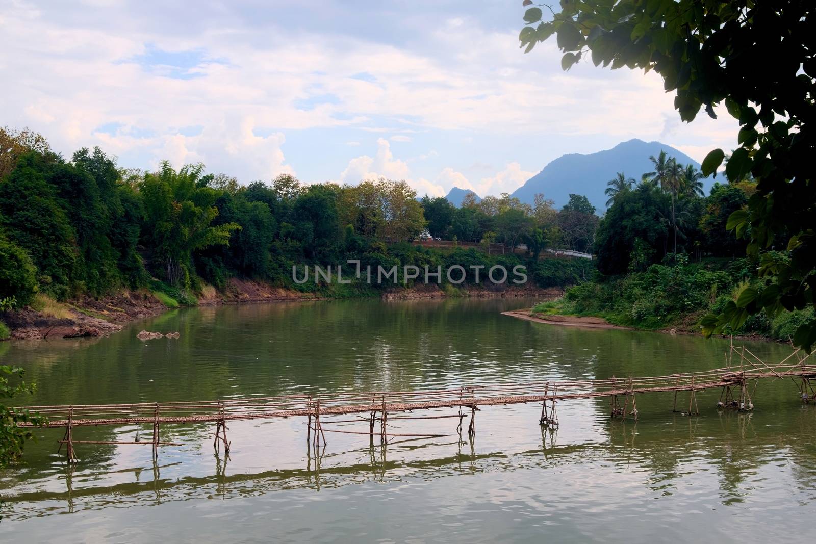 Bamboo bridge over Nam Khan river, in the confluence with Mekong River in Luang Prabang, Laos.