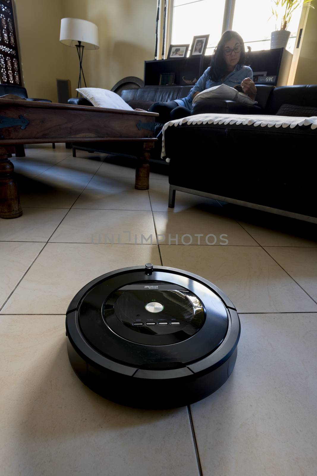 Roomba iRobot vaccum cleaner in a saloon by GABIS