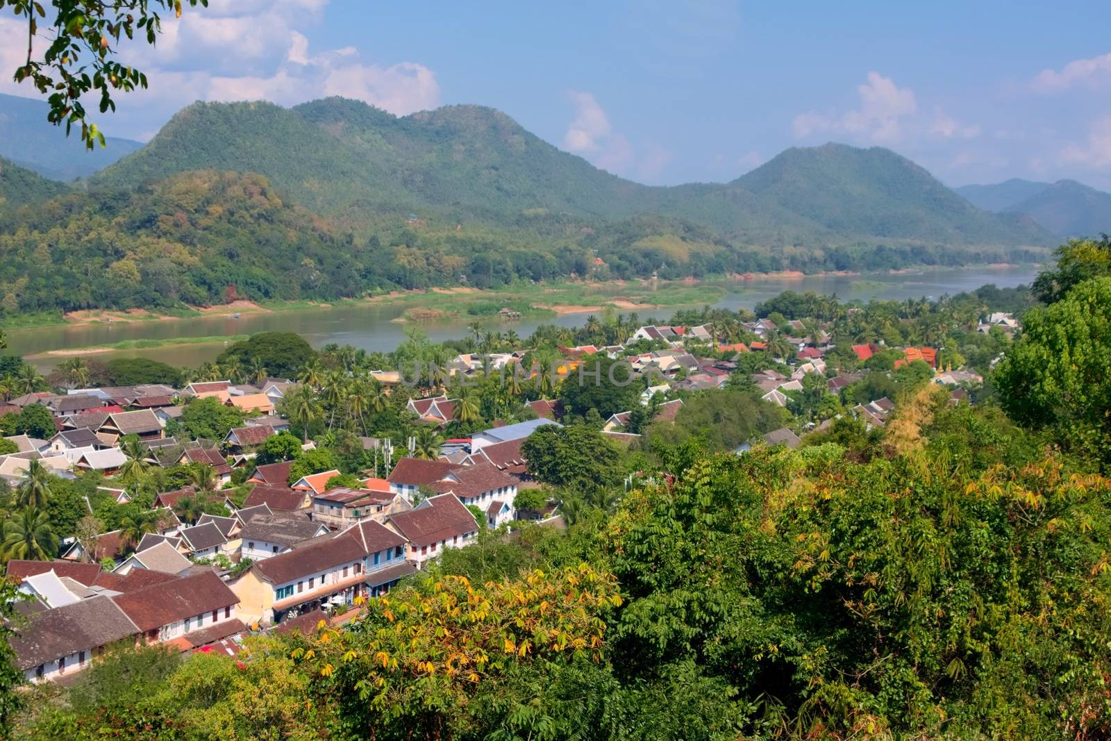 Elevated view of the town of Luang Prabang, Laos, from Mt. Phou Si, with the Mekong River on the background. by hernan_hyper