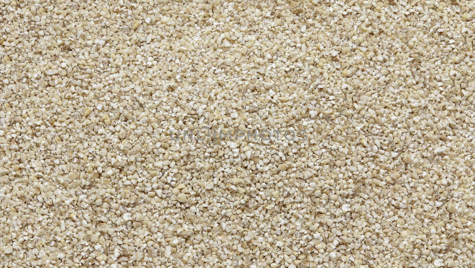 Raw crashed barley -texture and details - traditional food, top view