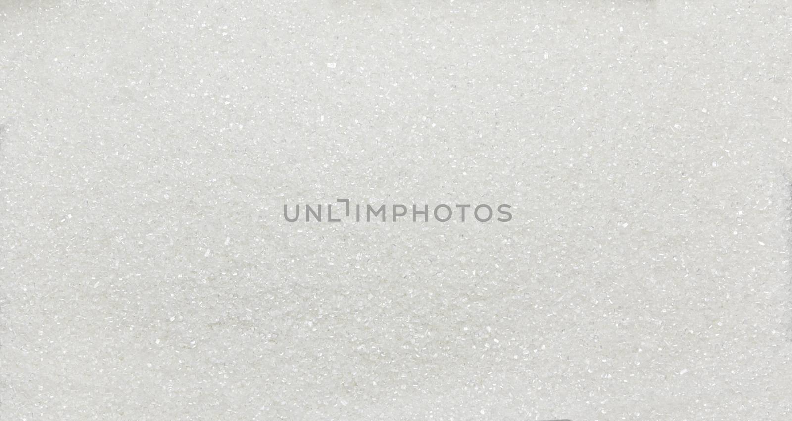 Heap of white sugar crystals - texture and details, close up