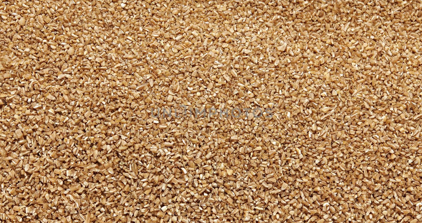 Crushed spelt groats - traditional food - texture and detail, close up