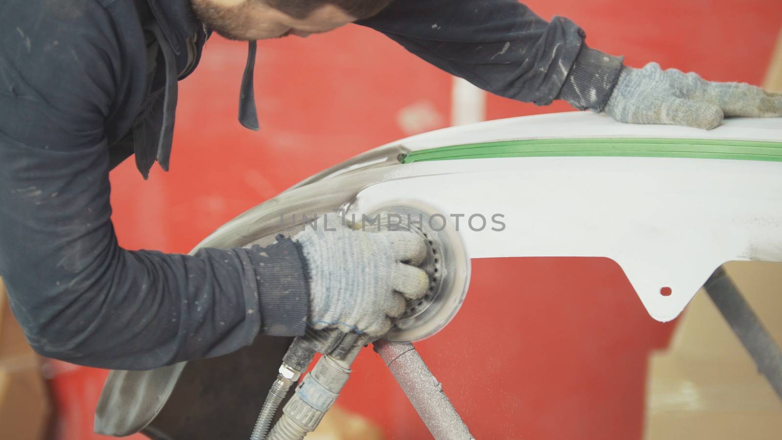 Automobile service - a worker polishes a car, close up by Studia72