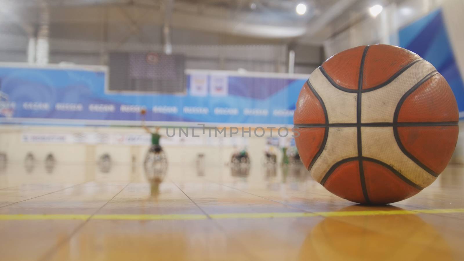 Training of disabled sportsmen - playing wheelchair basketball, wide angle