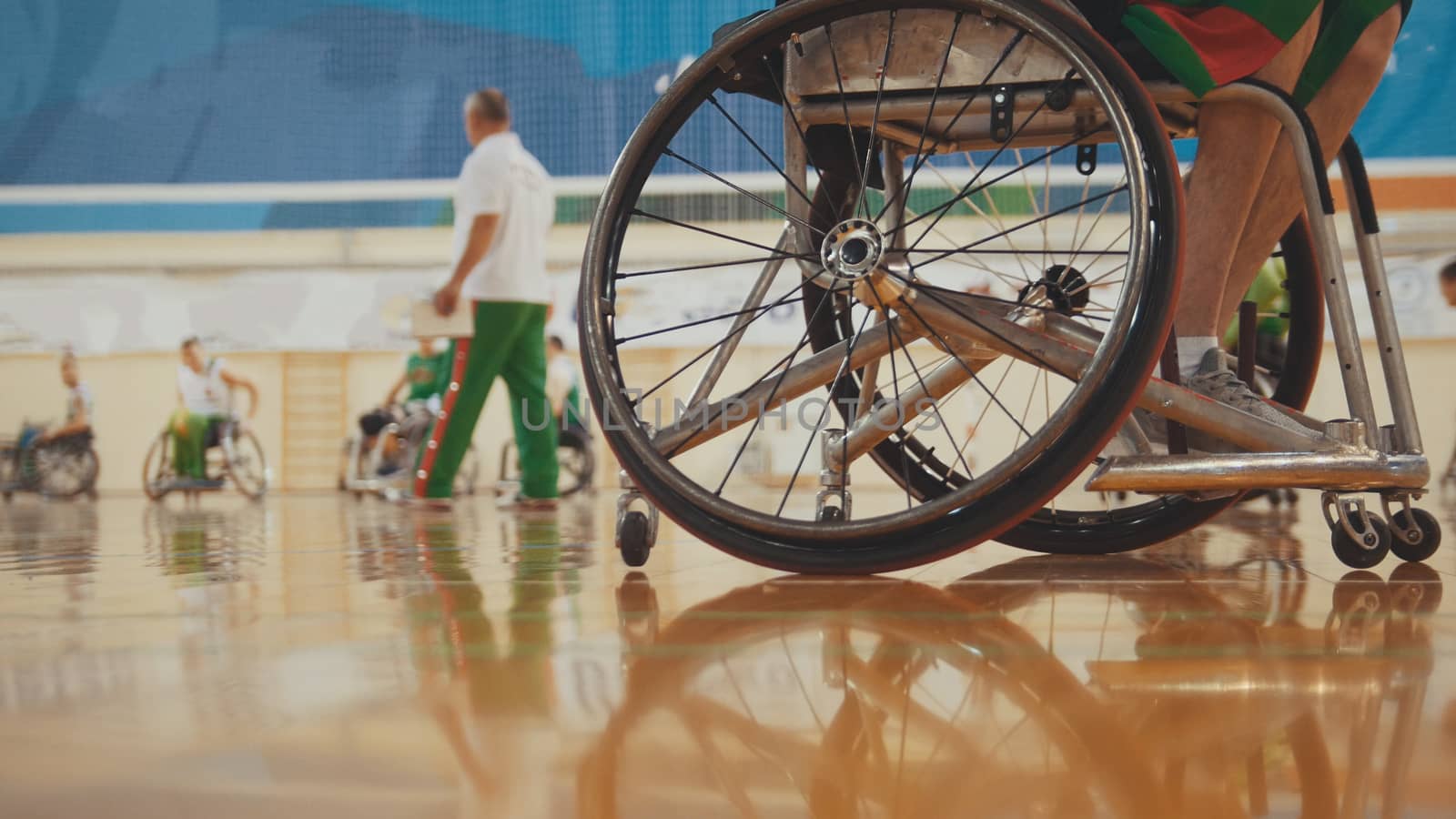 Wheel of handicapped basketball player in a wheelchair during sportive training by Studia72