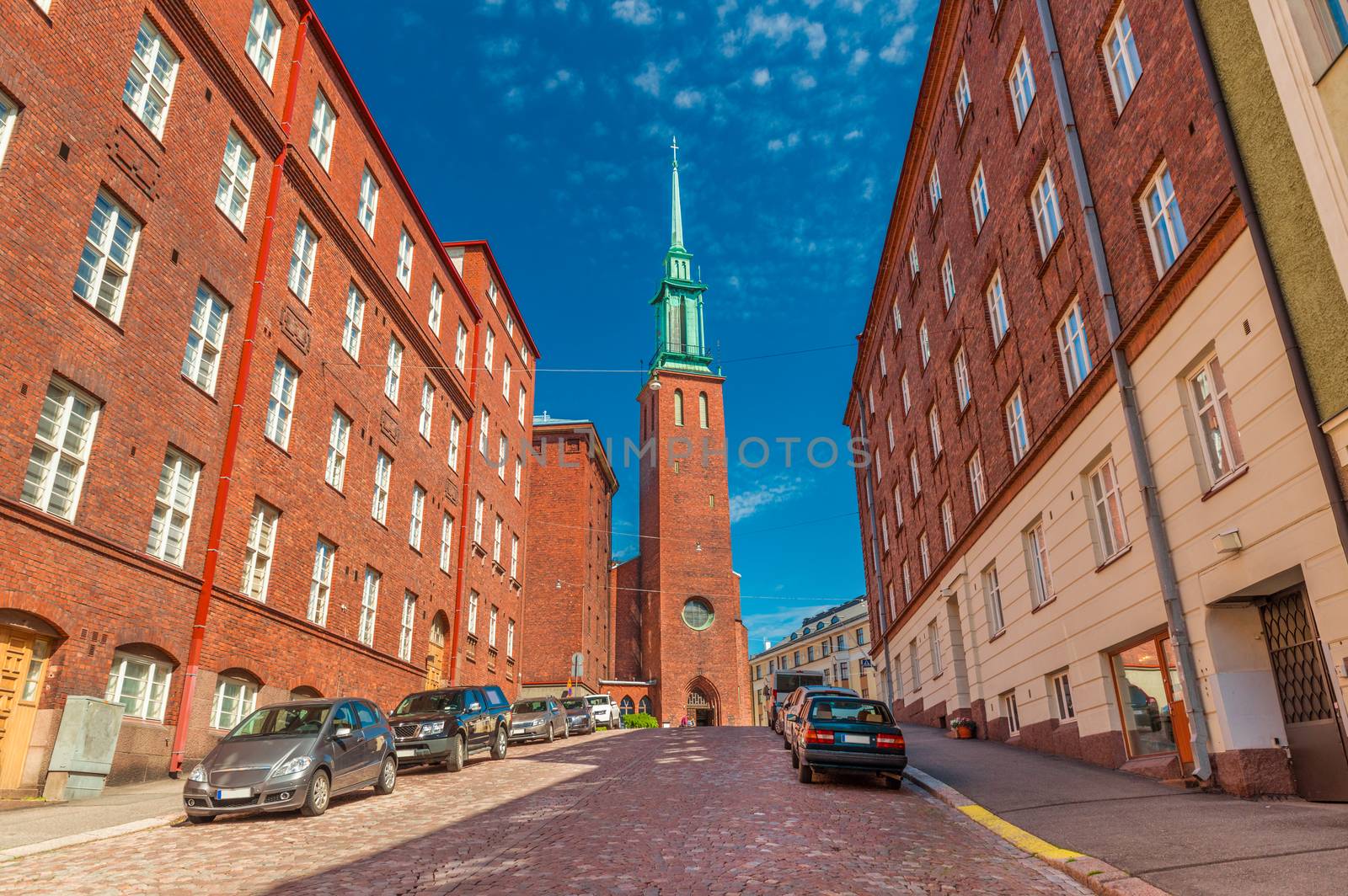 A street of Helsinki with the traditional architecture and a Church (Kristuskyrkan), in the Finnish neo-gothic style