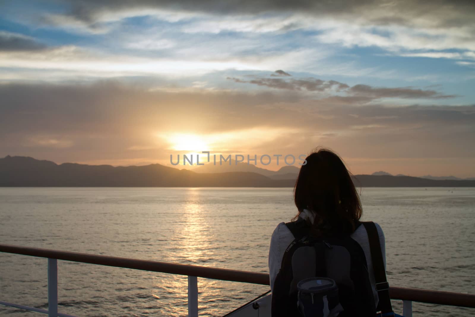 Young woman girl with backpack on shoulder shot from behind admi by robbyfontanesi